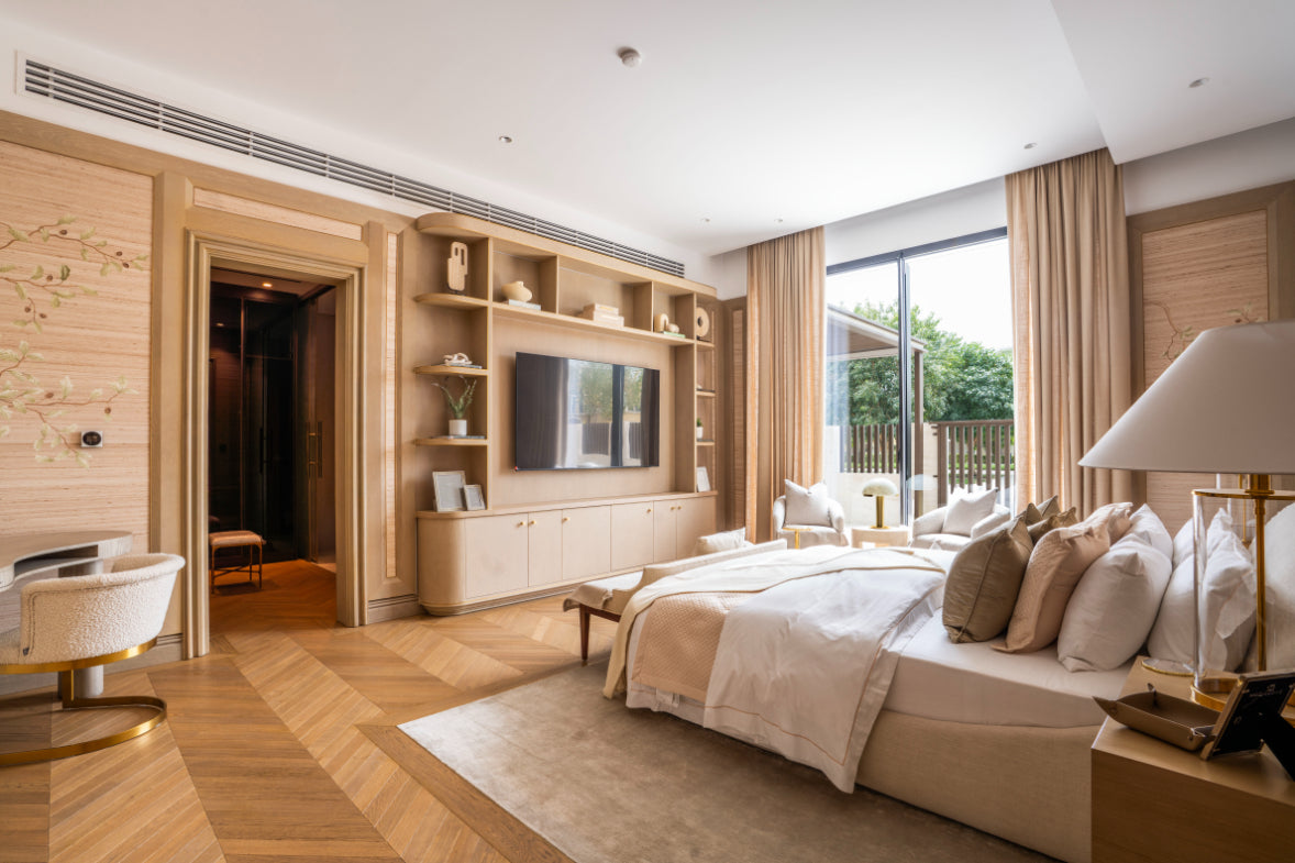Bedroom with upholstered bed and garden window – Jumeirah Park Villa interior design by Hive Living, Dubai