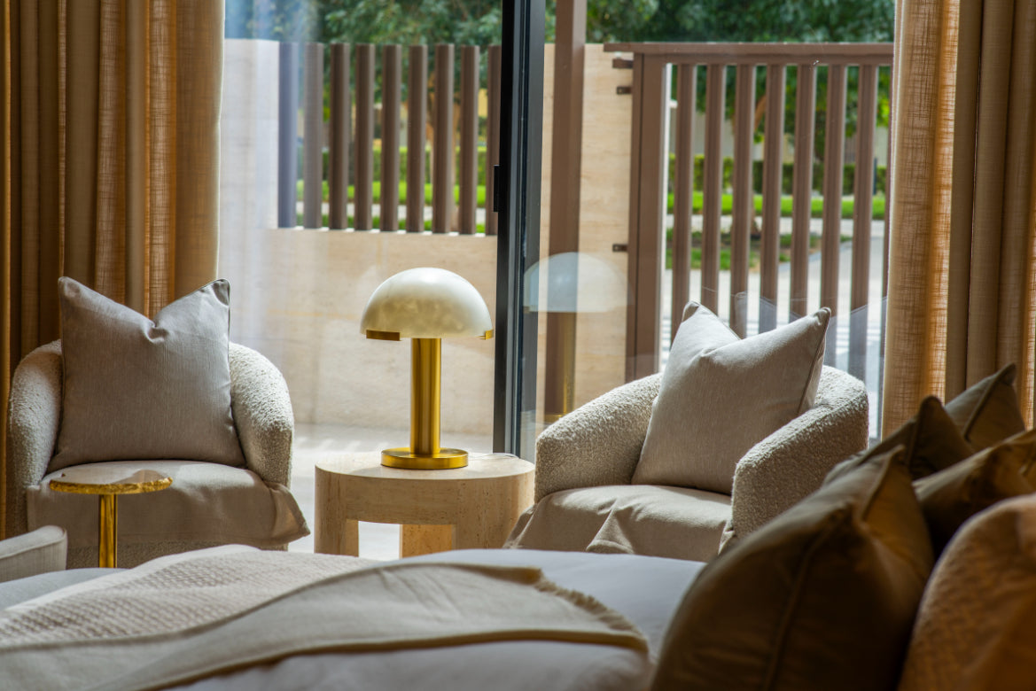 Terrace seating with outdoor lamp and garden view – Jumeirah Park Villa interior design by Hive Living, Dubai